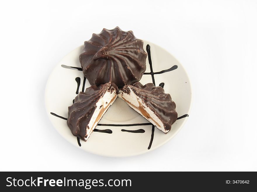Zephyr in chocolate on white plate