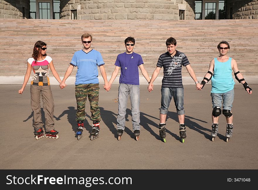 Group of people in rollers skates. Group of people in rollers skates