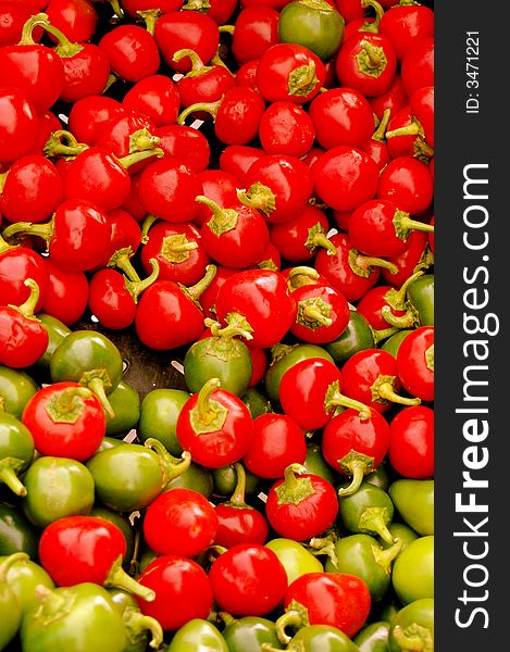 Colorful red and green peppers at a farmer's market