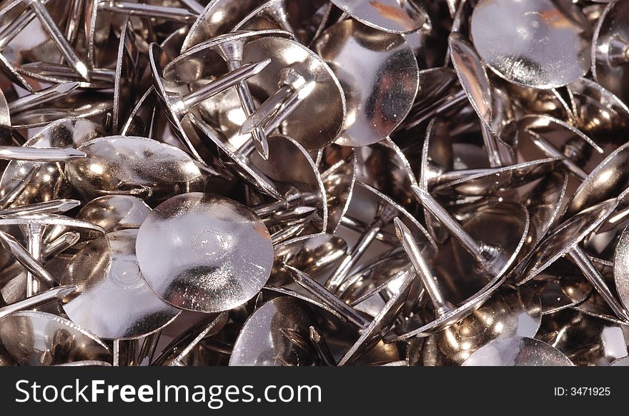 Thumbtack background, many steel thumbtack