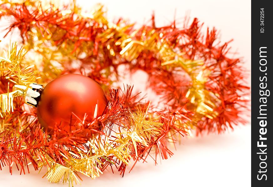 Christmas ball with garland on white