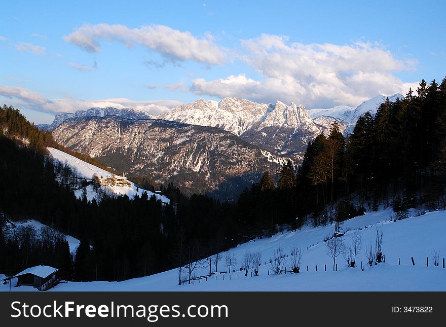 Clouds , Snow and Mountains. Alps, Austria not so far from Salzburg . White clouds on the background of blue sky .