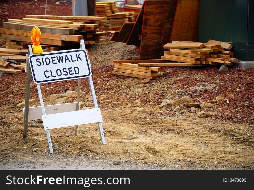 Sidewalk Closed sign near a construction zone