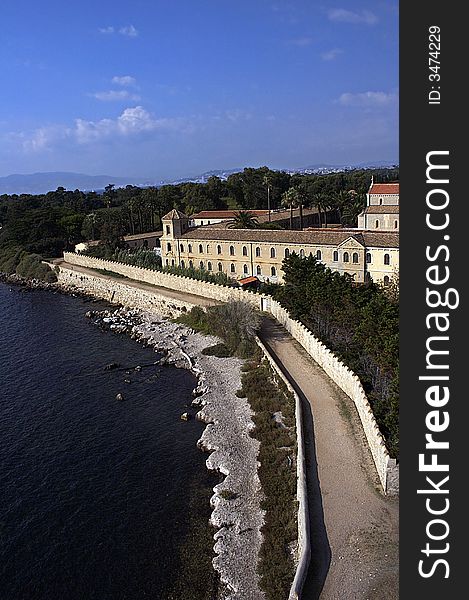 Panoramic picture of island's coastline and the castle on it. Panoramic picture of island's coastline and the castle on it