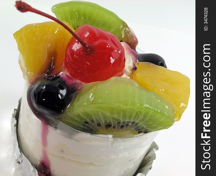 Mixed fruit topping on a small cake