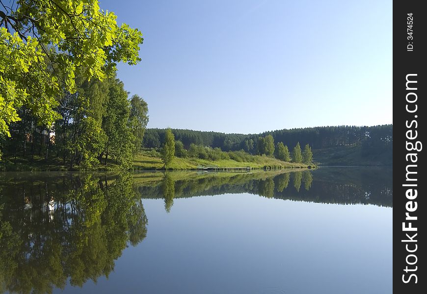 Early morning on coast of small lake. Early morning on coast of small lake