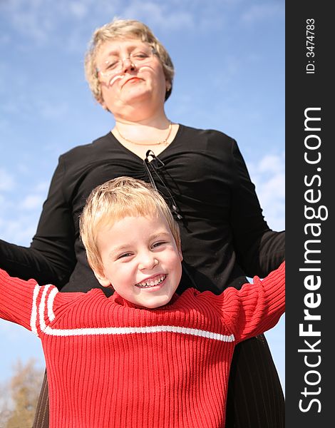 Grandmother with the grandson against sky. Grandmother with the grandson against sky