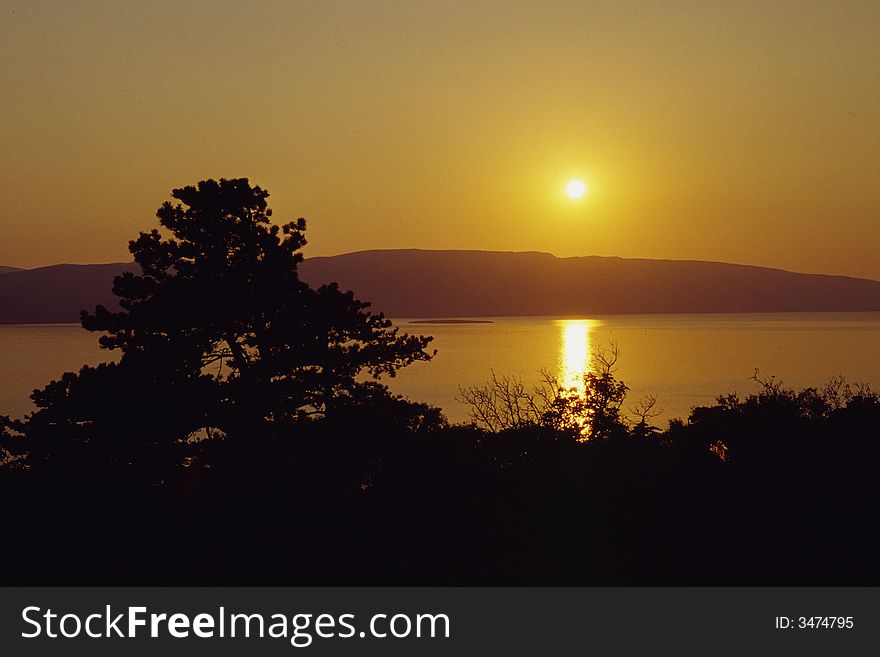 Golden sunset on sea and island