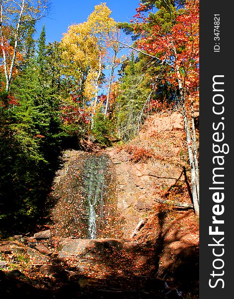 Water falls in Michigan upper peninsula during autumn time. Water falls in Michigan upper peninsula during autumn time