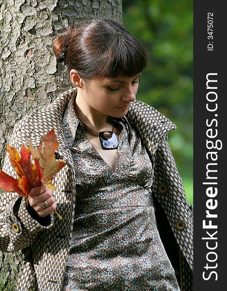 Beautiful woman walking in the autumn park. Beautiful woman walking in the autumn park