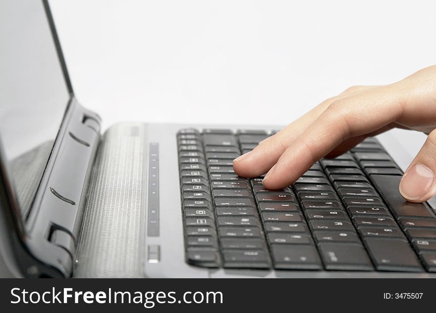 Female hands typing a text on keyboard
