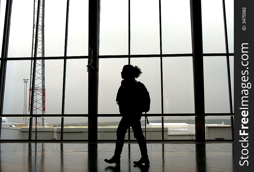 Traveller at an airport, walking to next gate