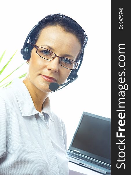 View of nice operator in stylish glasses at her working place. View of nice operator in stylish glasses at her working place