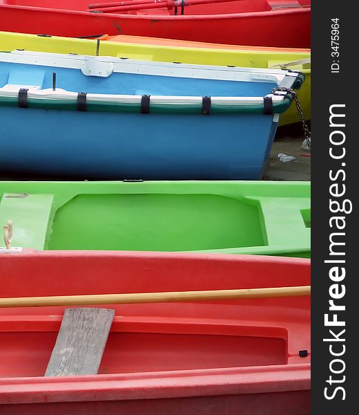 A view of colourful boats on a beach