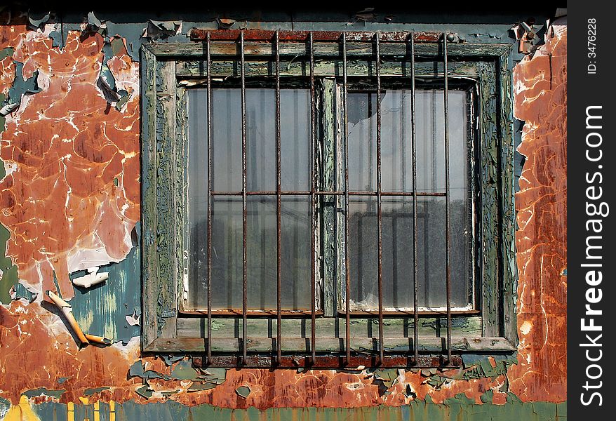 It is rust window of an old train. It is rust window of an old train.