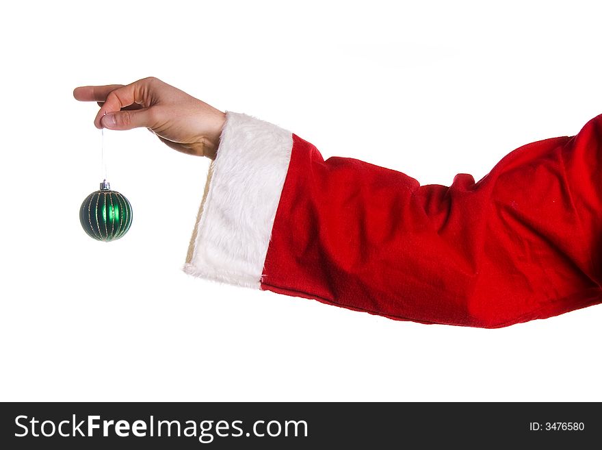 Santa hand holding a green xmas tree ball. Santa hand holding a green xmas tree ball