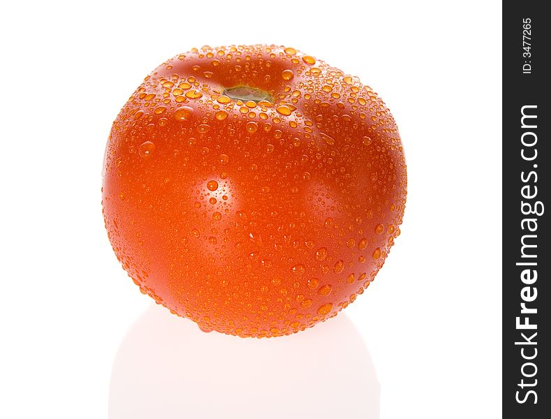 Ripe tomato with dewdrops isolated. Ripe tomato with dewdrops isolated