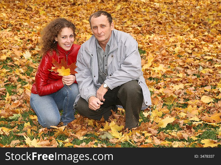 Daughter with the father in the park in autumn. Daughter with the father in the park in autumn