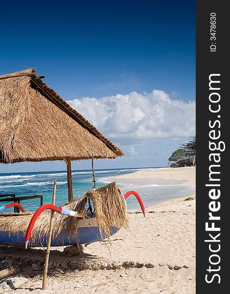 Traditional fishing boat parked at beach hut