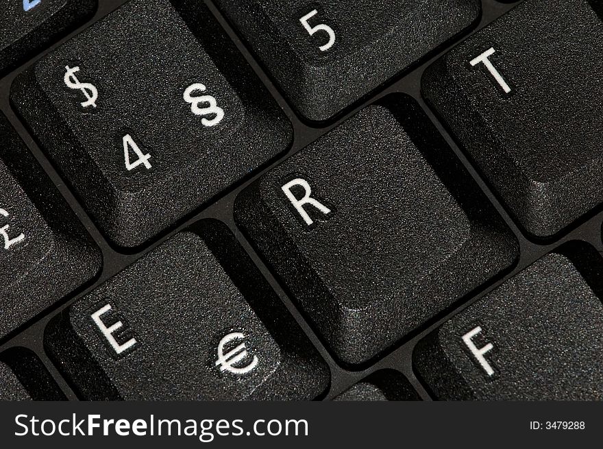 Black keyboard closeup with white letters