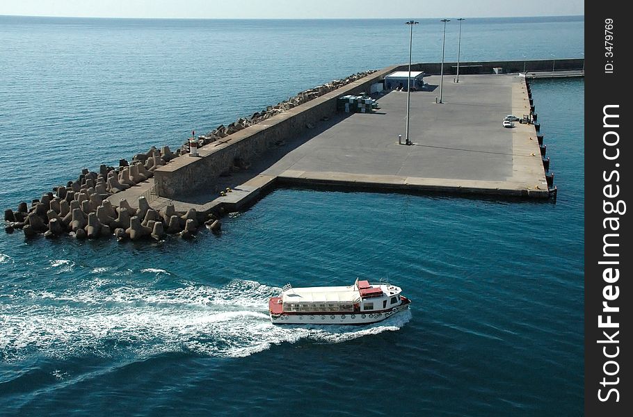 Little boat sailing in glittering sea. Little boat sailing in glittering sea