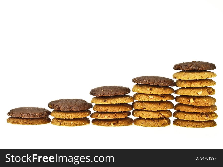 Step of increase stack almond cookie with brown cookie on top on white background. Step of increase stack almond cookie with brown cookie on top on white background