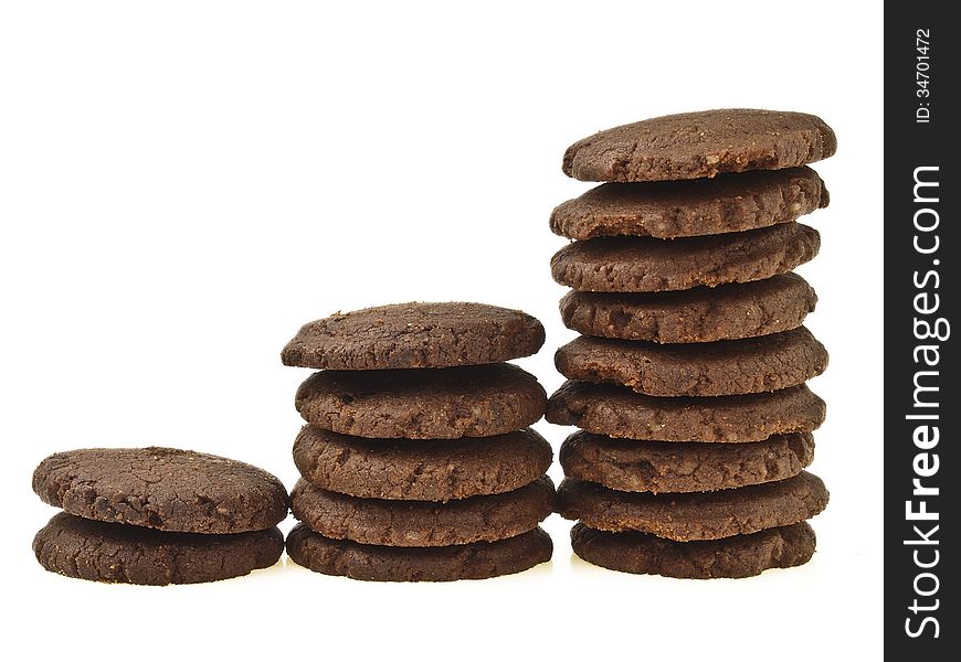 Three step increase of chocolate cookie stack on white background. Three step increase of chocolate cookie stack on white background
