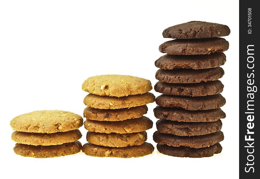 Three step stack increase of chocolate cookie and almond cookie on white background. Three step stack increase of chocolate cookie and almond cookie on white background