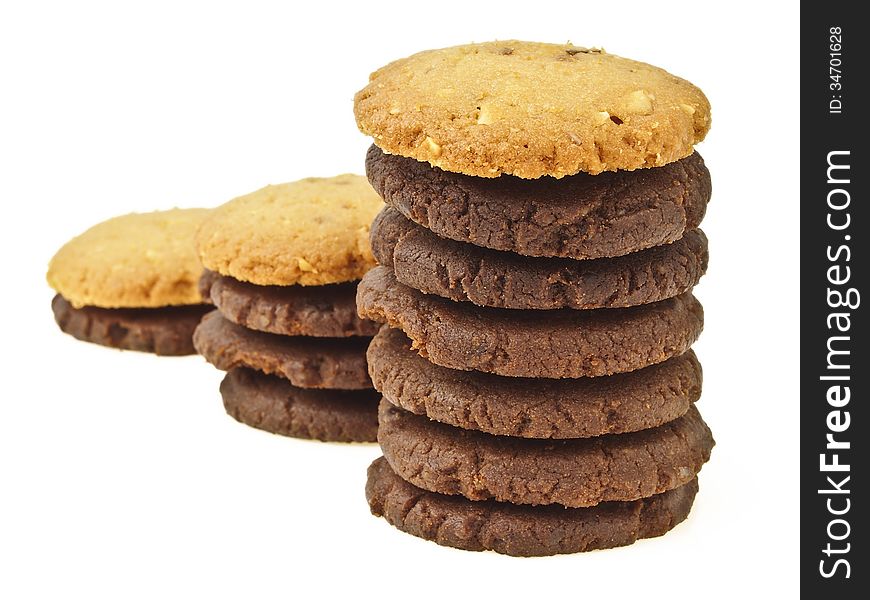 Perspective of three step stack of chocolate cookie with almond cookie on top on white background. Perspective of three step stack of chocolate cookie with almond cookie on top on white background