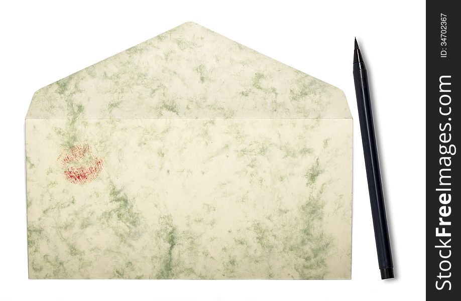 Envelope with lipstick print and japanese pen, isolated on white.