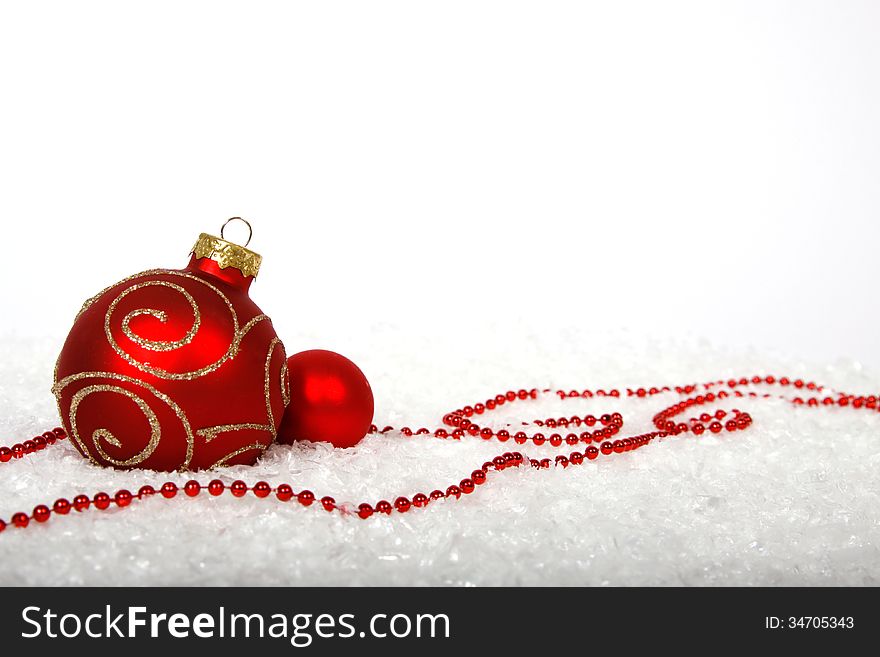 Red baubles on the snow. Red baubles on the snow