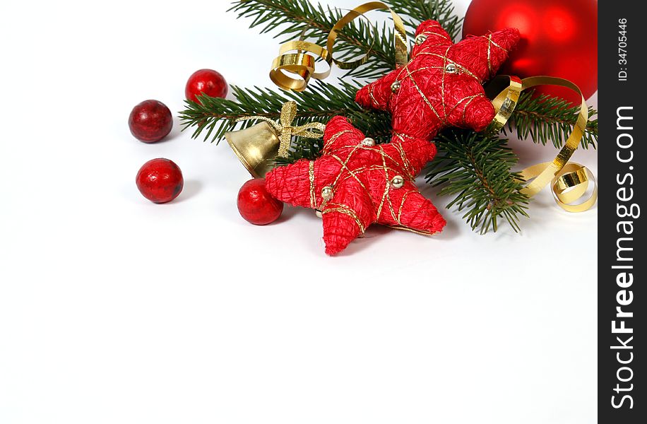 Christmas decoration with the twigs of the spruce and red stars