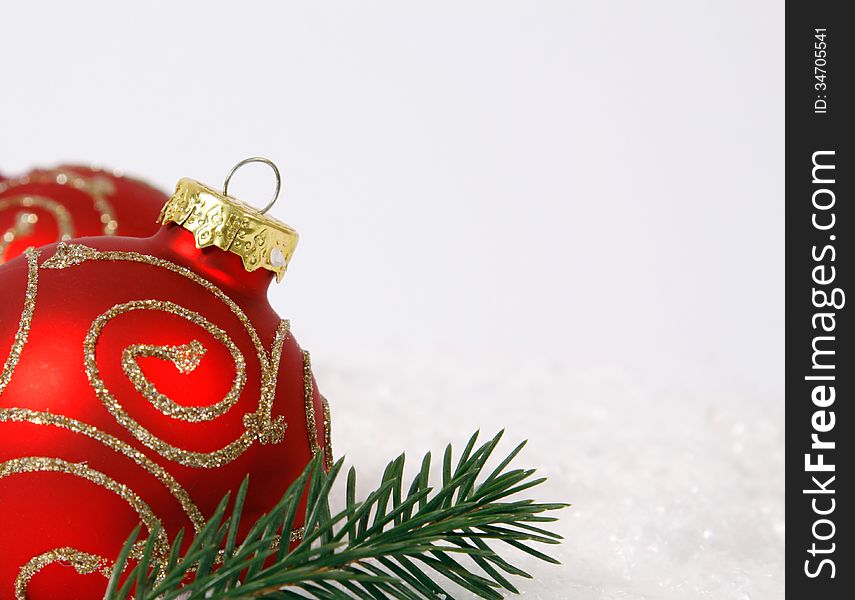 Red-golden baubles on the white background. Red-golden baubles on the white background