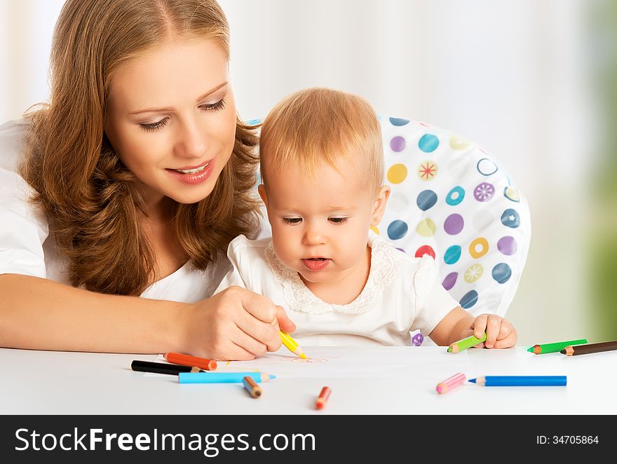 Mother and baby draw color pencil