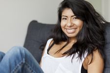 Portrait Of A Serene Spanish Woman Relaxing At Home Stock Image