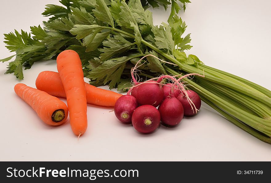 Ingredients for a tasty vegetable salad on white background