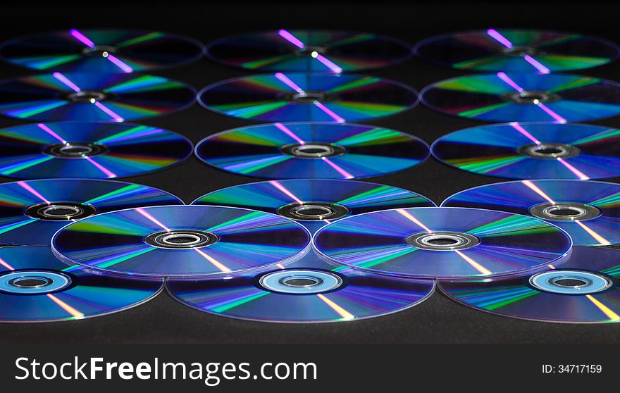 CD or DVD disc over black background