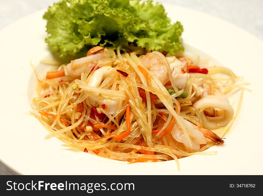 Som Tam (Green Papaya Salad) is a very popular traditional and modern thai food