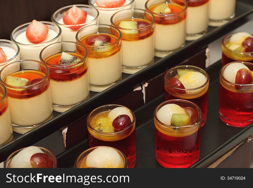 Panna cotta with fresh fruit in glasses