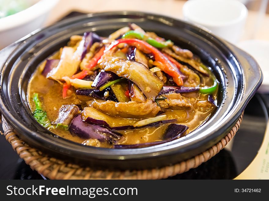 Stewed Eggplants with Garlic Sauce in Clay Pot. Stewed Eggplants with Garlic Sauce in Clay Pot