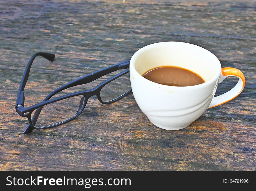 Hot Coffee In White Cup On A Wooden Table