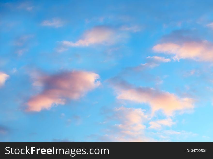 Beautiful cloudscape on bright sunset sky as background. Beautiful cloudscape on bright sunset sky as background