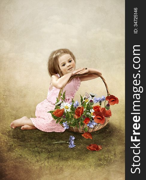 The little girl in field with a basket of flowers. The little girl in field with a basket of flowers