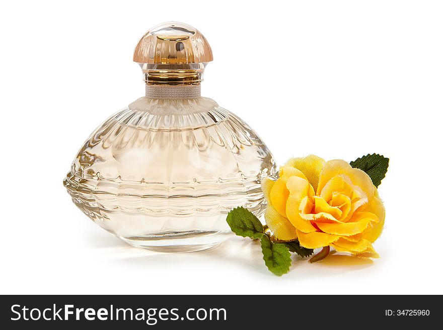 Women's perfume and a flower isolated on white background. Women's perfume and a flower isolated on white background