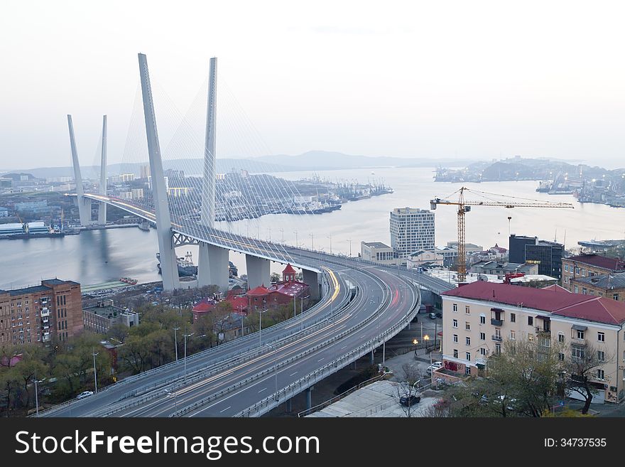 The big suspension bridge in the evening shined with fires