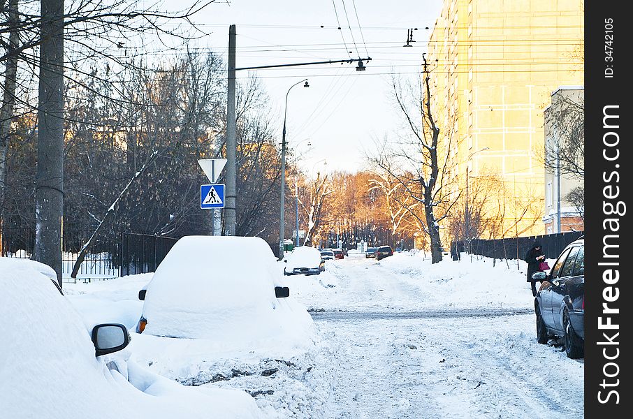 Snowy winter street, parked cars. Snowy winter street, parked cars