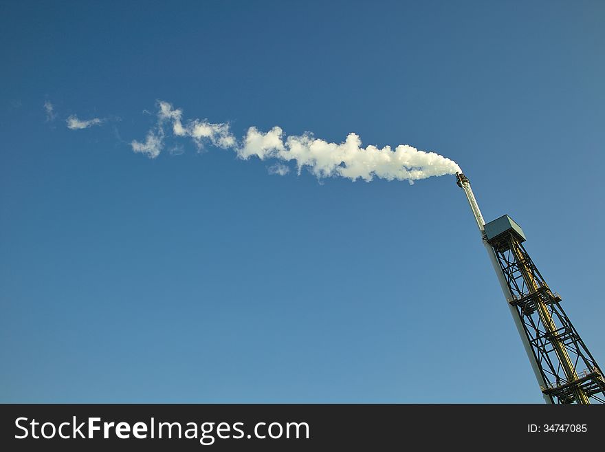 Air pollution from chimney in a factory. Air pollution from chimney in a factory