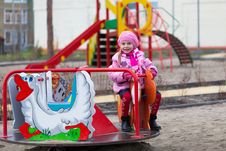 Girl On The Carousel Stock Photos