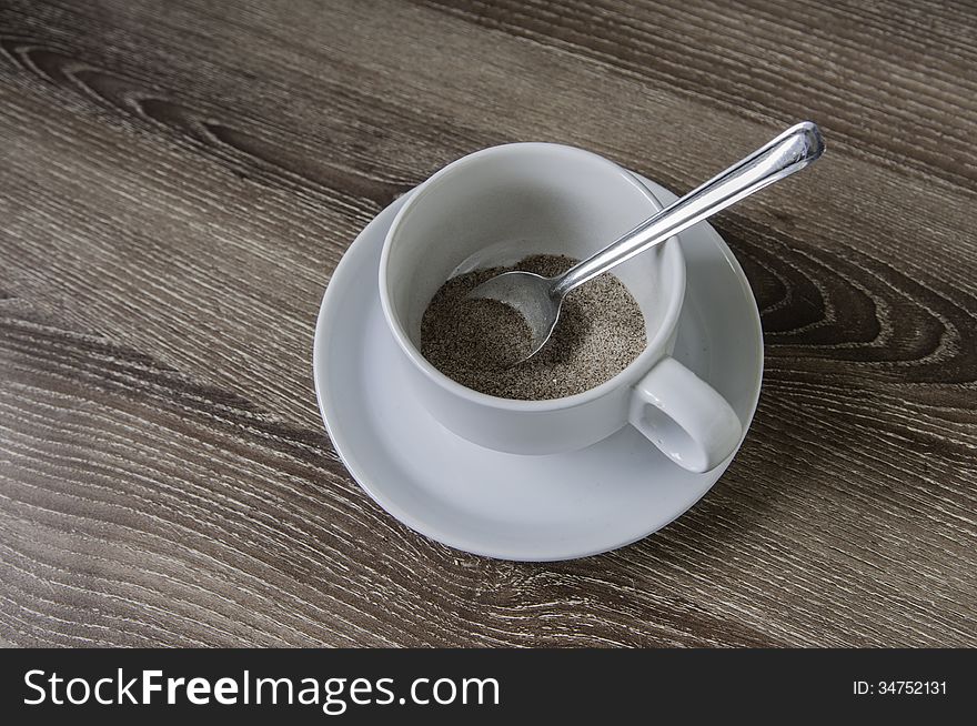 Cup of coffee on the wooden floor color Brown. Cup of coffee on the wooden floor color Brown