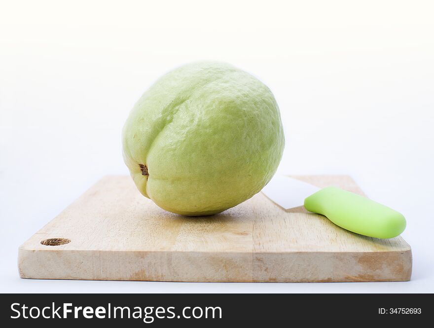 Guava fruit on chopping board with clean white background